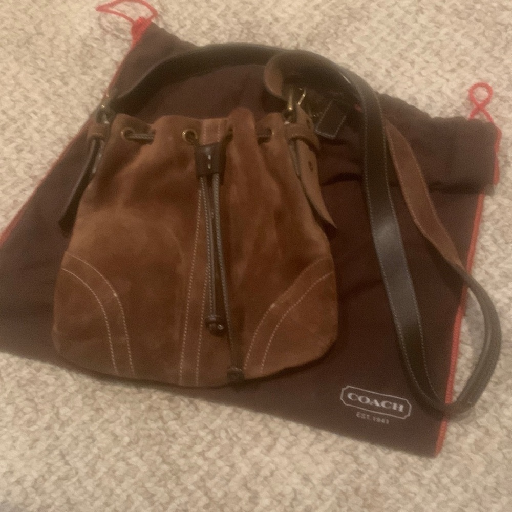 Brown Coach shoulder or crossbody drawstring style purse